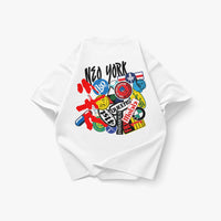 Back view of an oversized white heavyweight T-shirt featuring a collage of New York-inspired stickers, graffiti-style artwork, and FKONYC branding inspired by Mobb Deep and Akira. The graphic combines “New York” lettering, Queens references, colorful decals, anime-inspired elements, and layered street-culture graphics that fuse the visual energy of Akira with the gritty aesthetic of Mobb Deep’s The Infamous. Product shown on a clean white background.