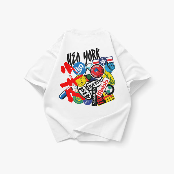 Back view of an oversized white heavyweight T-shirt featuring a collage of New York-inspired stickers, graffiti-style artwork, and FKONYC branding inspired by Mobb Deep and Akira. The graphic combines “New York” lettering, Queens references, colorful decals, anime-inspired elements, and layered street-culture graphics that fuse the visual energy of Akira with the gritty aesthetic of Mobb Deep’s The Infamous. Product shown on a clean white background.